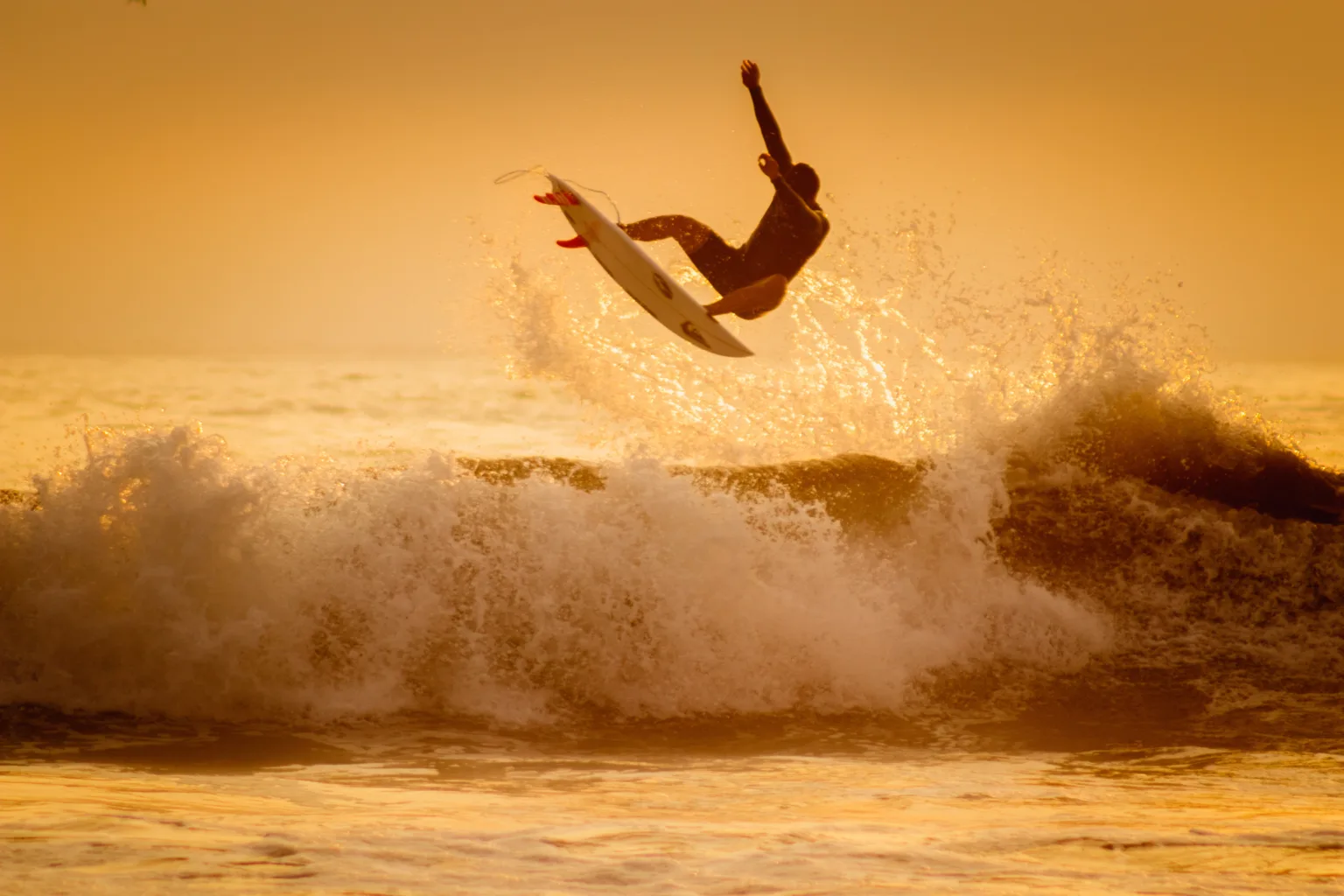 Surfer performing an air in Puerto Viejo