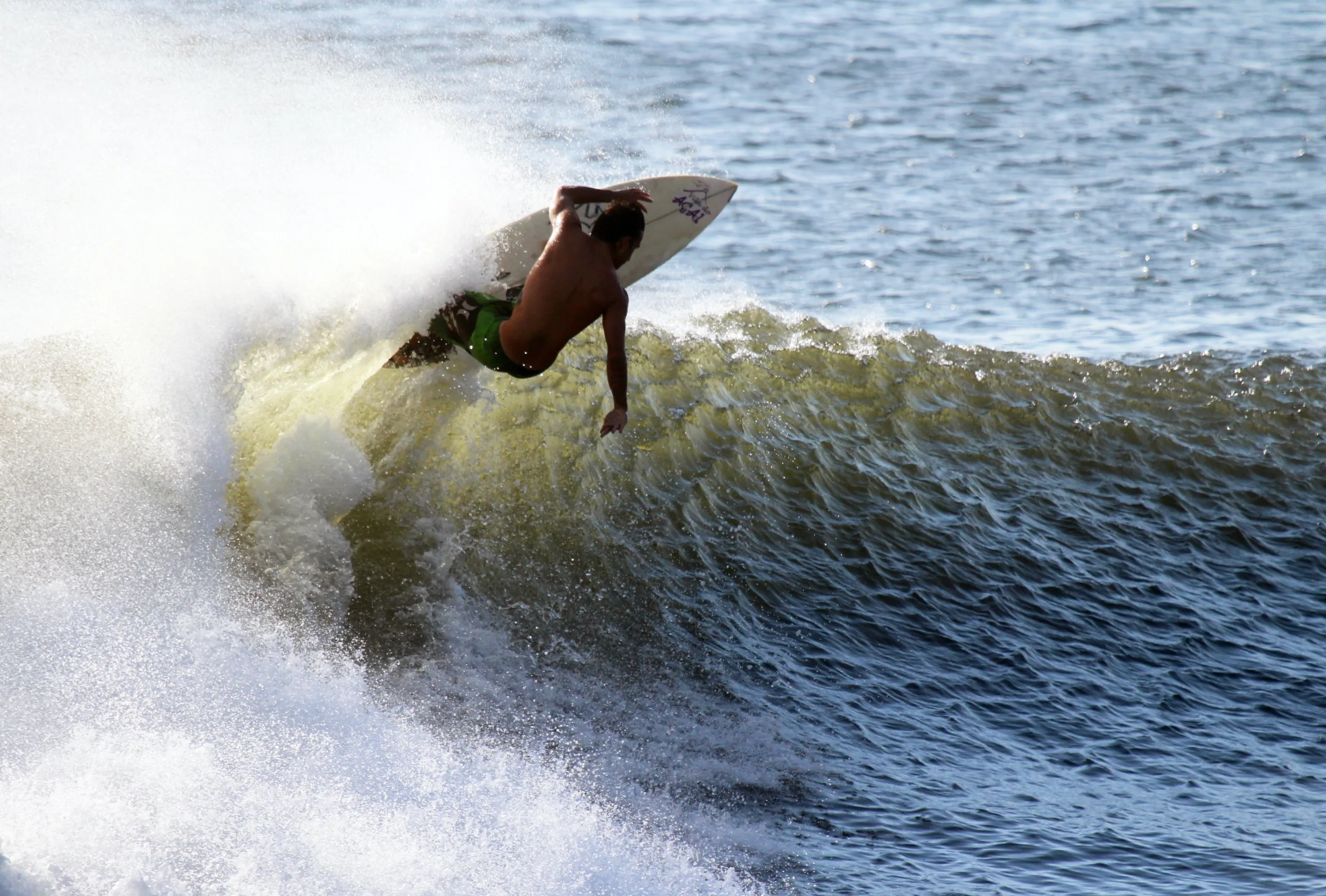 Surfer Riding Wave in Canggu Bali